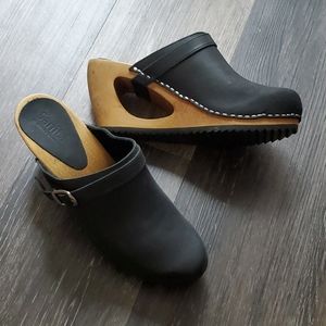 Sanita black leather clogs